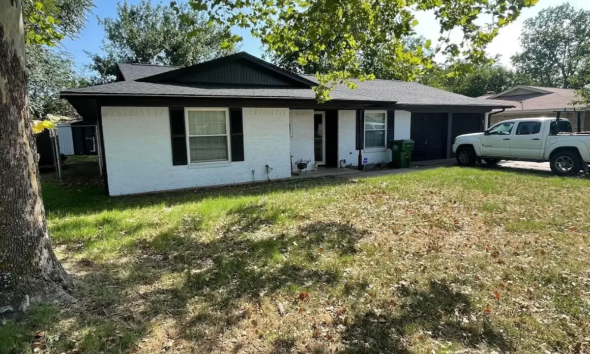 Professional roofing crew working on a residential roof in Niagara Falls